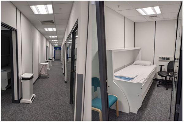 hospital rest room with bed that converts to a desk